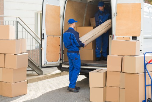 Moving van and packed boxes for removals in Norbiton